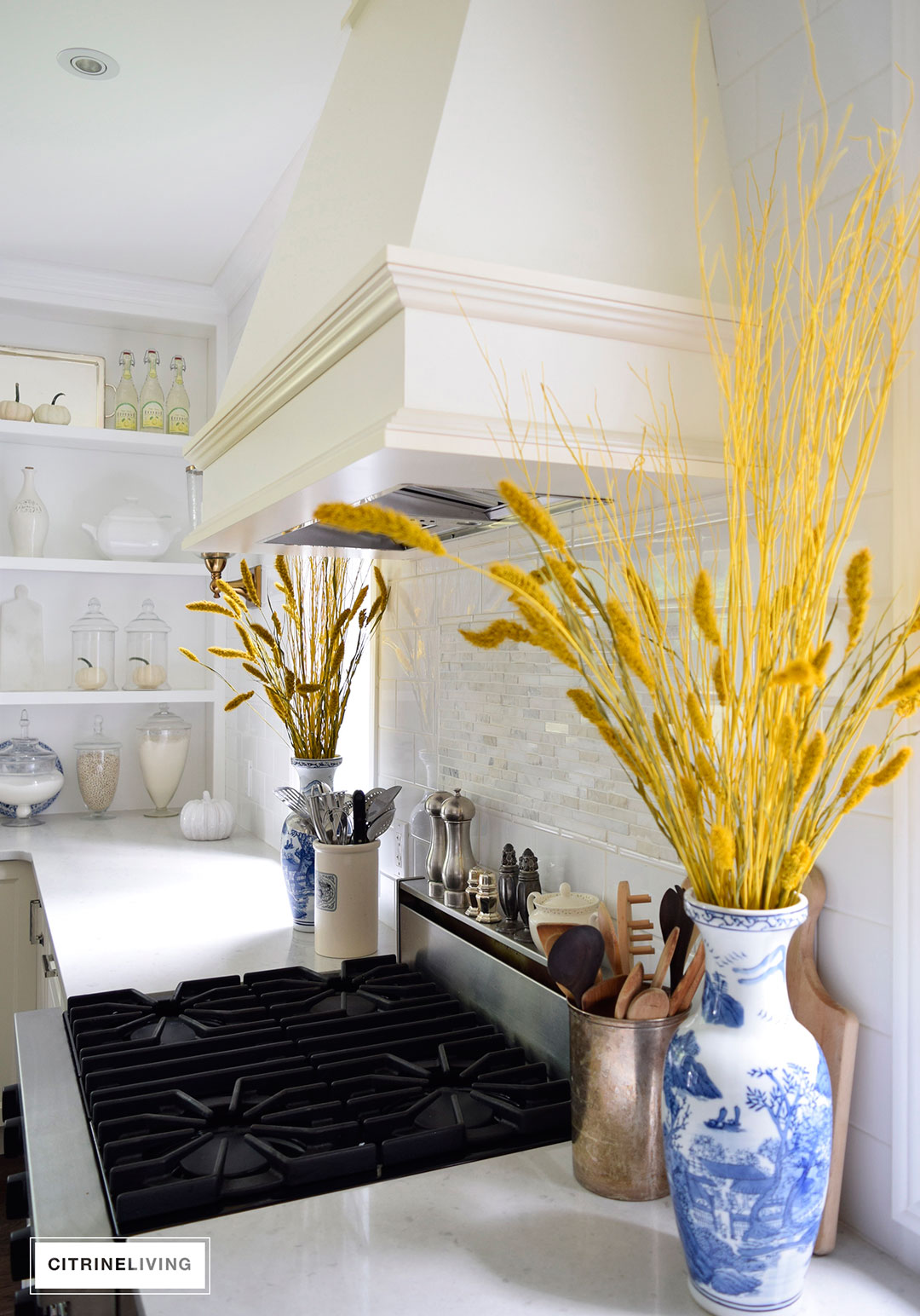 Fall decorated kitchen with blue and white ginger jars, rich gold accents and figs as a decorative element