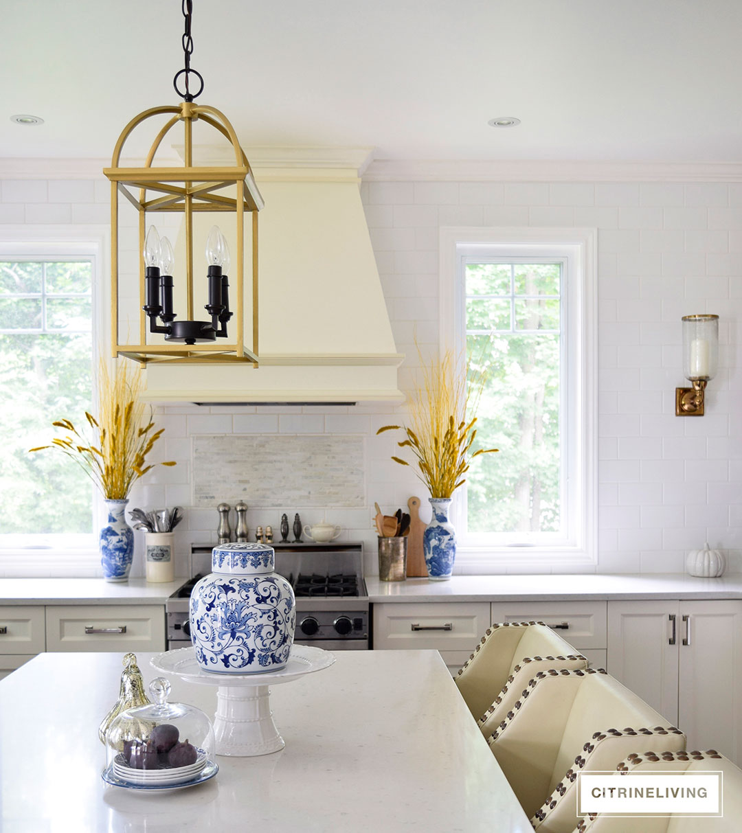 Fall decorated kitchen with blue and white ginger jars, rich gold accents and figs as a decorative element