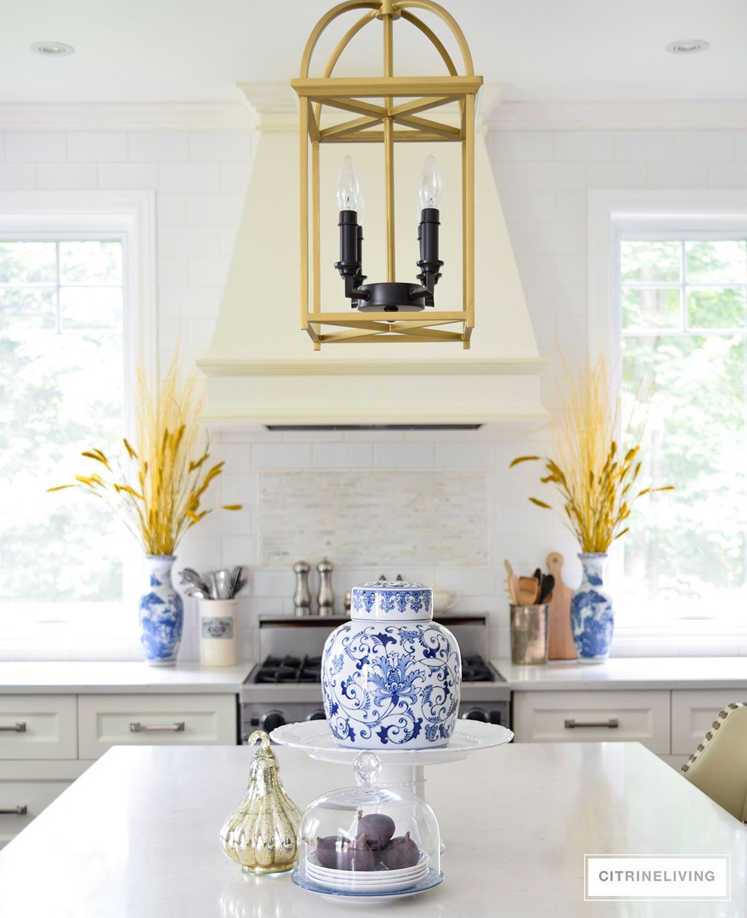 Fall decorated kitchen with blue and white ginger jars, rich gold accents and figs as a decorative element