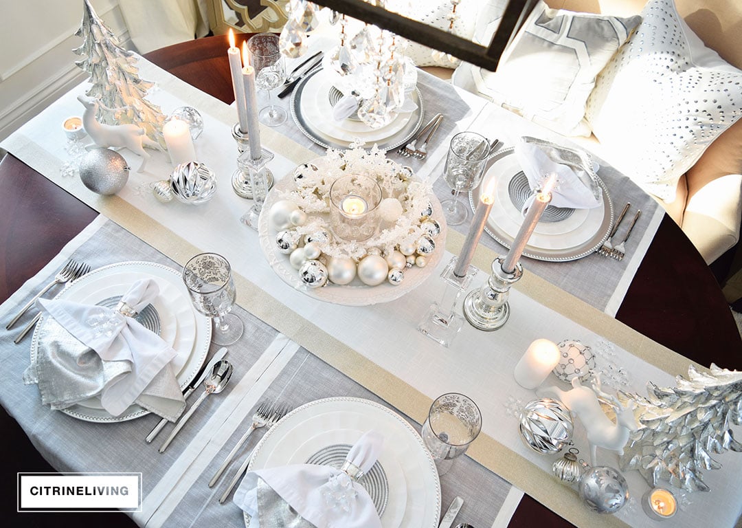 A WINTER WHITE AND SILVER HOLIDAY TABLESCAPE