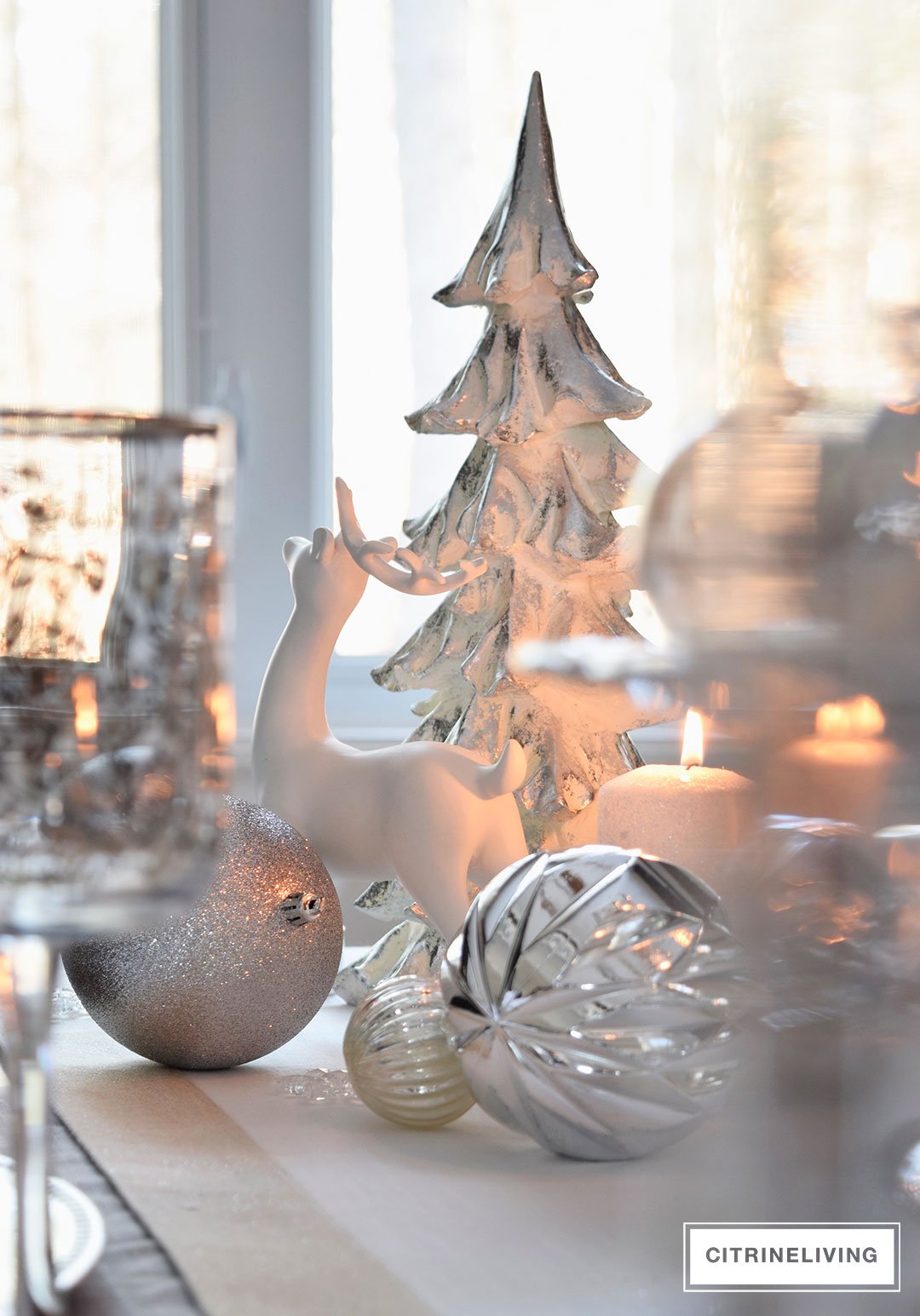 A WINTER WHITE AND SILVER HOLIDAY TABLESCAPE