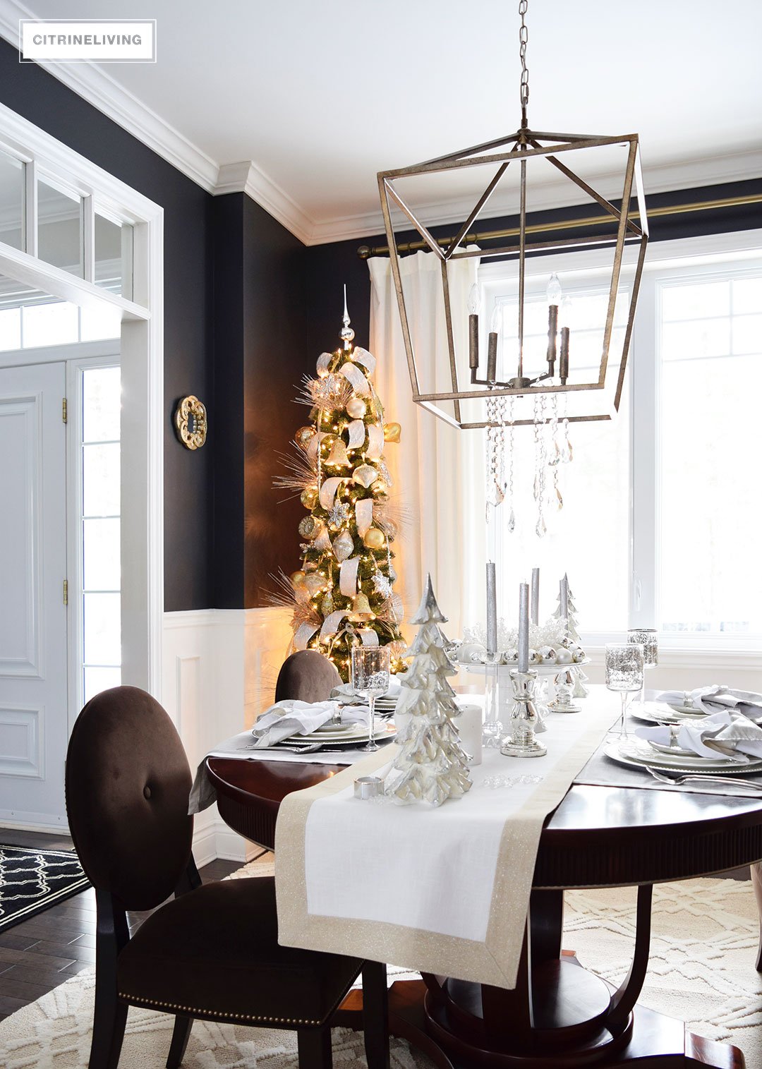 Christmas Home Tour - Create a stunning table with elegant silvers and layers of crisp white are chic and sophisticated