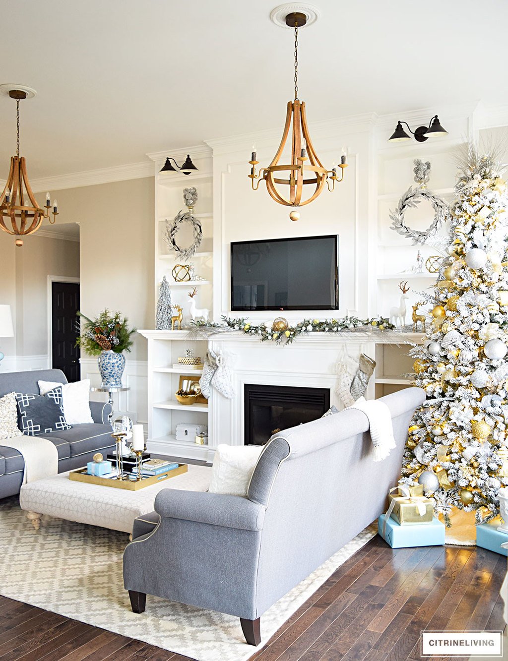 Christmas Home Tour - Gorgeous living room with beautiful metallics and icy blue create a chic Holiday theme