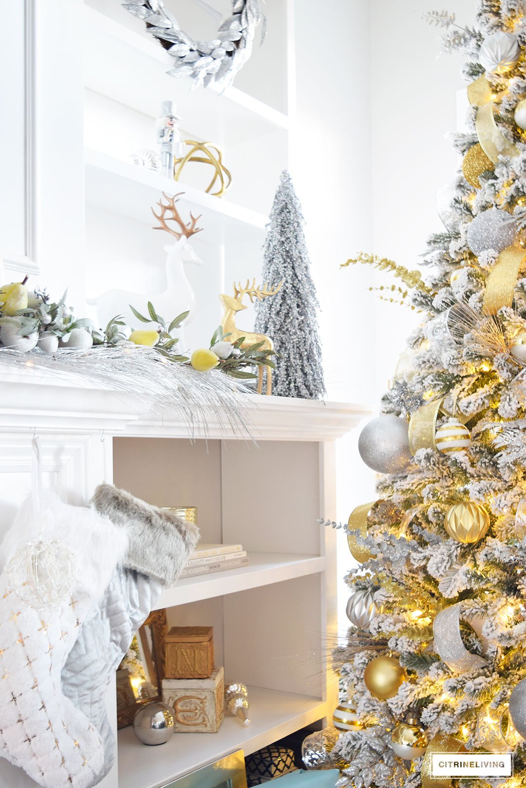 Christmas Home Tour - Stunning flocked Christmas tree with beautiful metallics and icy blue create a chic Holiday theme