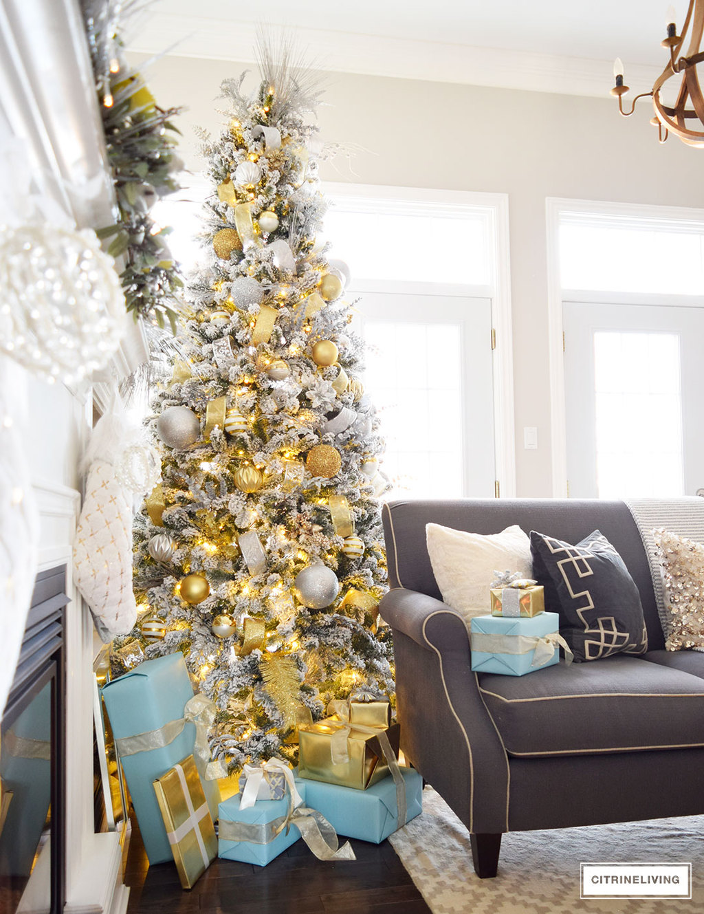 Christmas Home Tour - Stunning flocked Christmas tree with beautiful metallics and icy blue create a chic Holiday theme