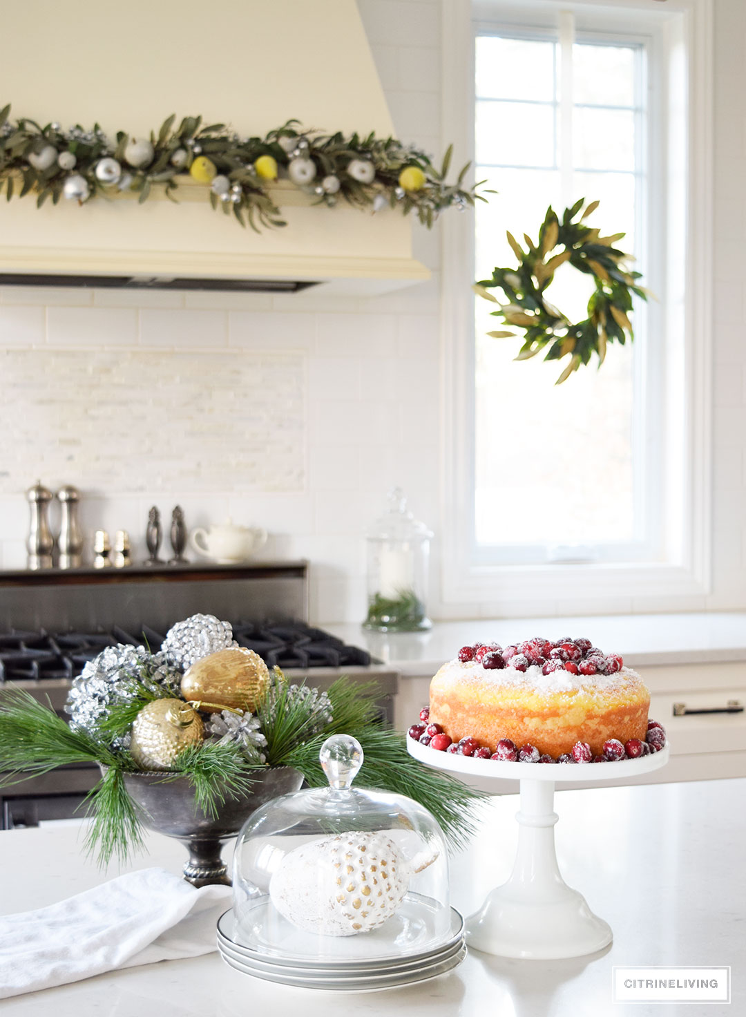 Christmas Home Tour - Elegant kitchen with mixed metallics and holiday greenery create a sophisticated Holiday theme