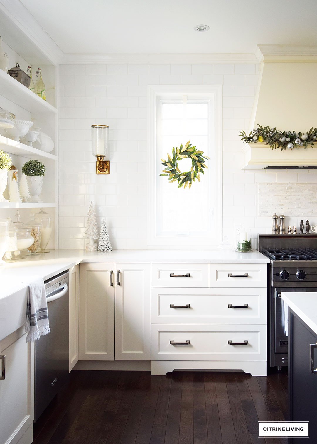 Christmas Home Tour - Elegant kitchen with mixed metallics and holiday greenery create a sophisticated Holiday theme