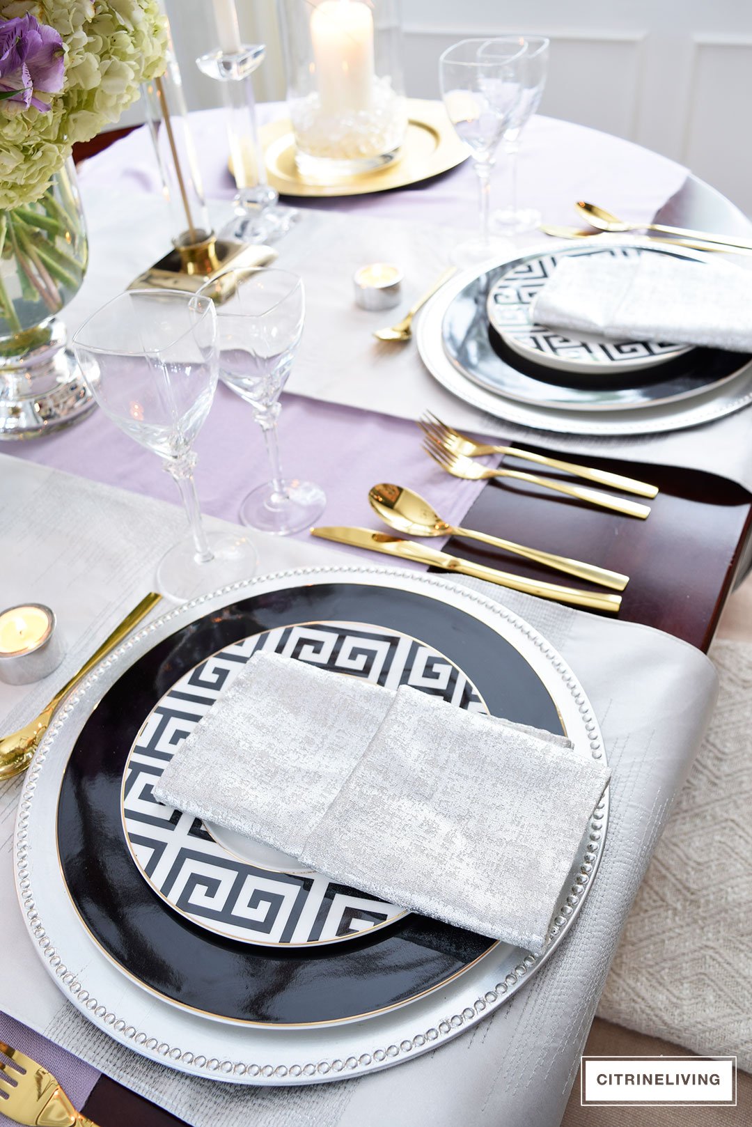 Lavender hues mixed with black and white, along with touches of metallics are a fresh take on a Valentine's Day tablescape for four.