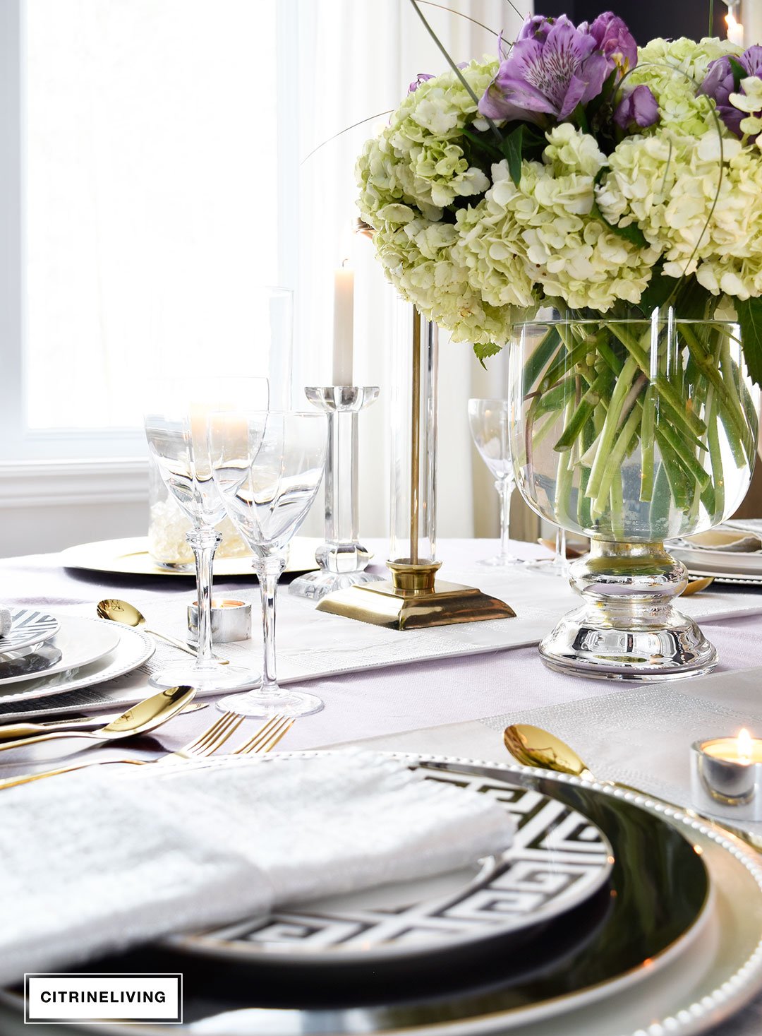 Lavender hues mixed with black and white, along with touches of metallics are a fresh take on a Valentine's Day tablescape for four.