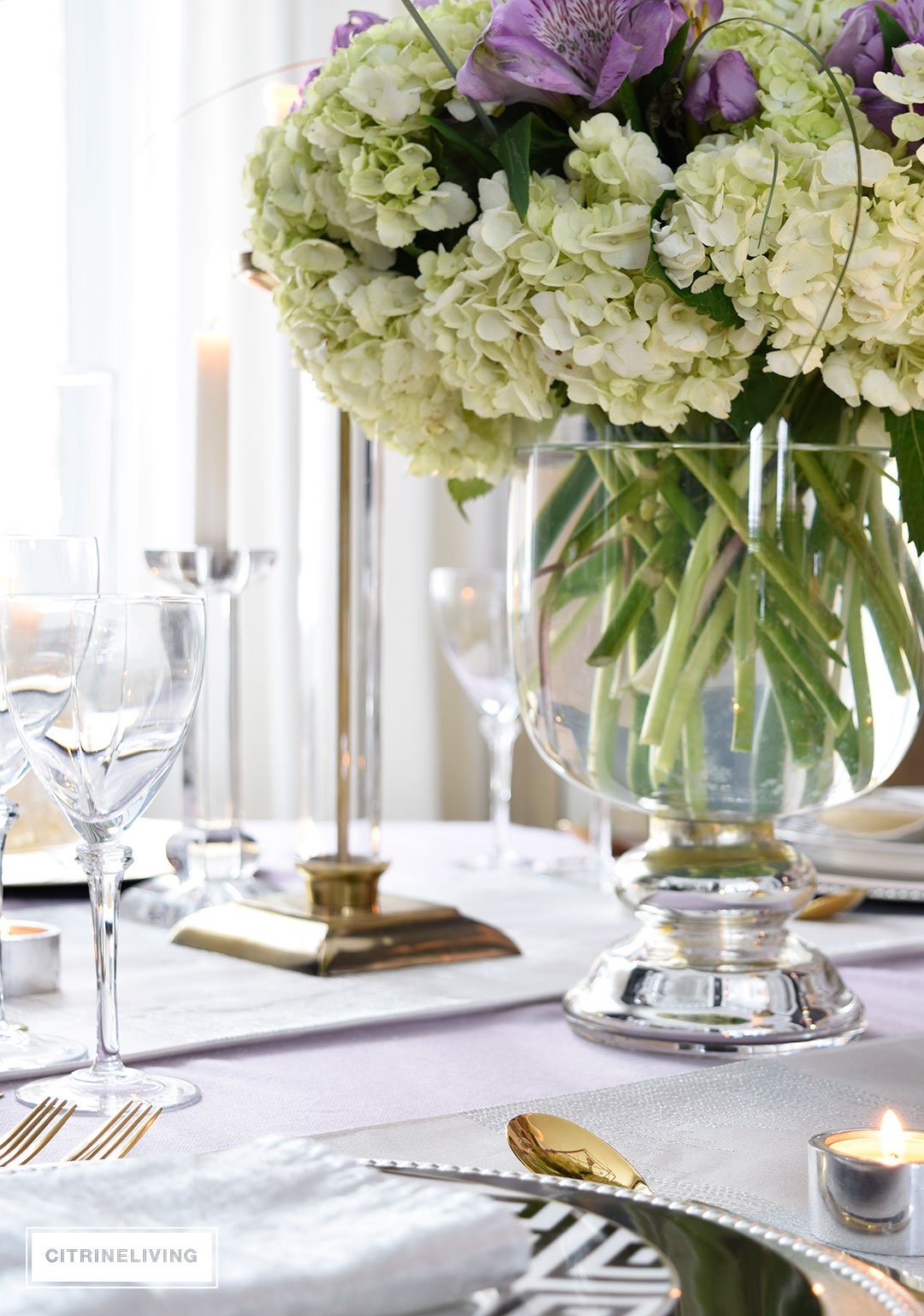 Lavender hues mixed with black and white, along with touches of metallics are a fresh take on a Valentine's Day tablescape for four.