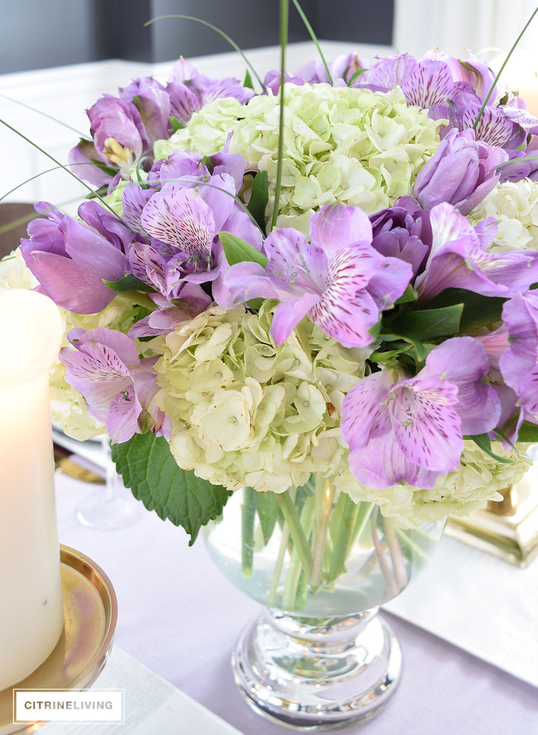 Lavender hues mixed with black and white, along with touches of metallics are a fresh take on a Valentine's Day tablescape for four.