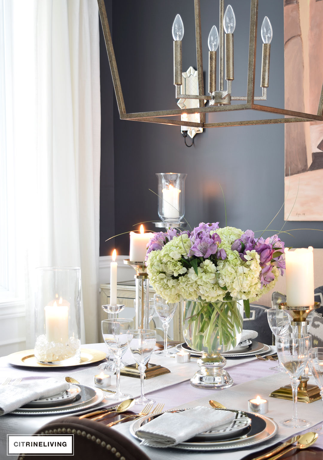 Lavender hues mixed with black and white, along with touches of metallics are a fresh take on a Valentine's Day tablescape for four.