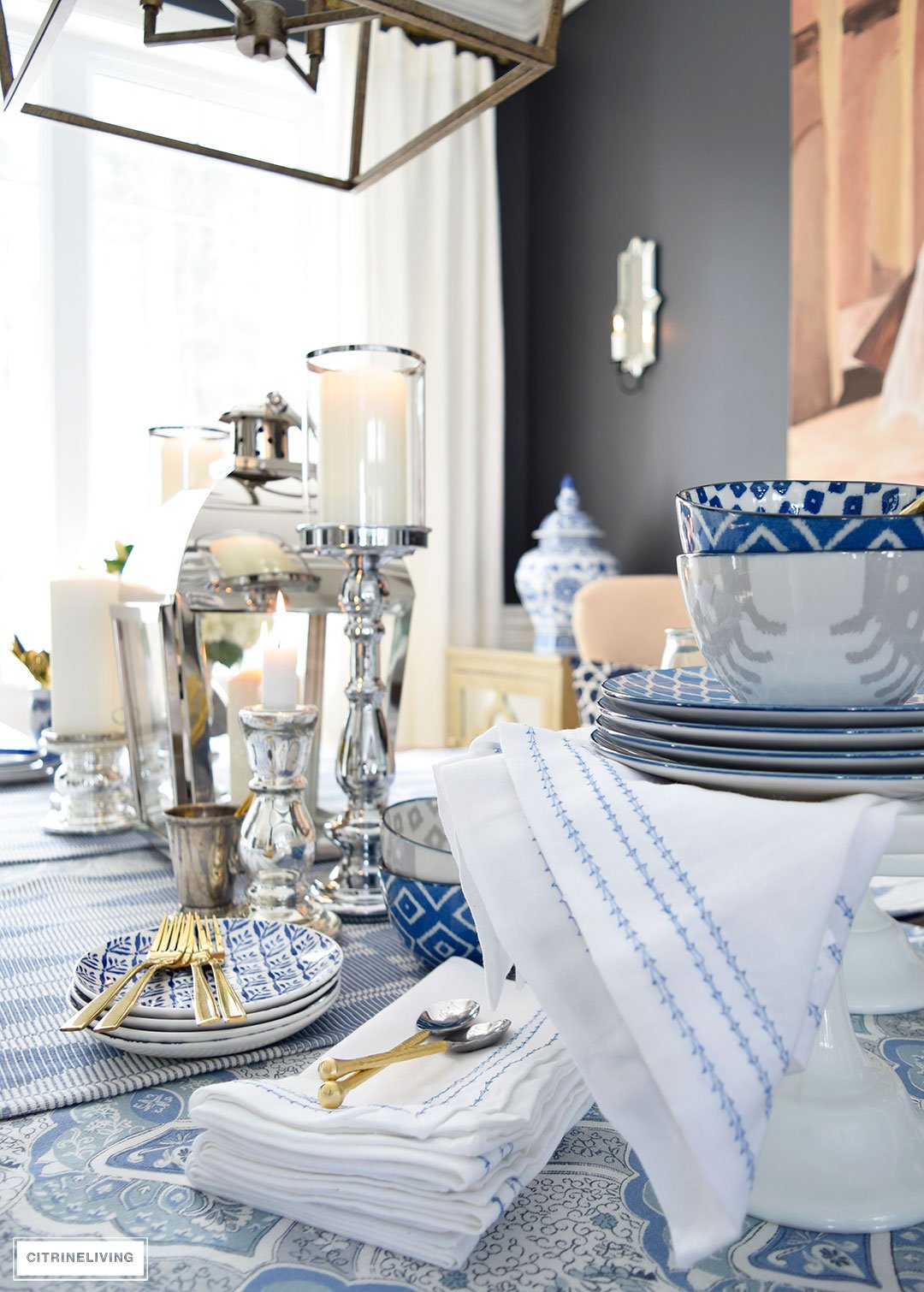 A mix of blue and white linens and dishes paired with mixed metal accessories is perfect for an elegant Spring table.