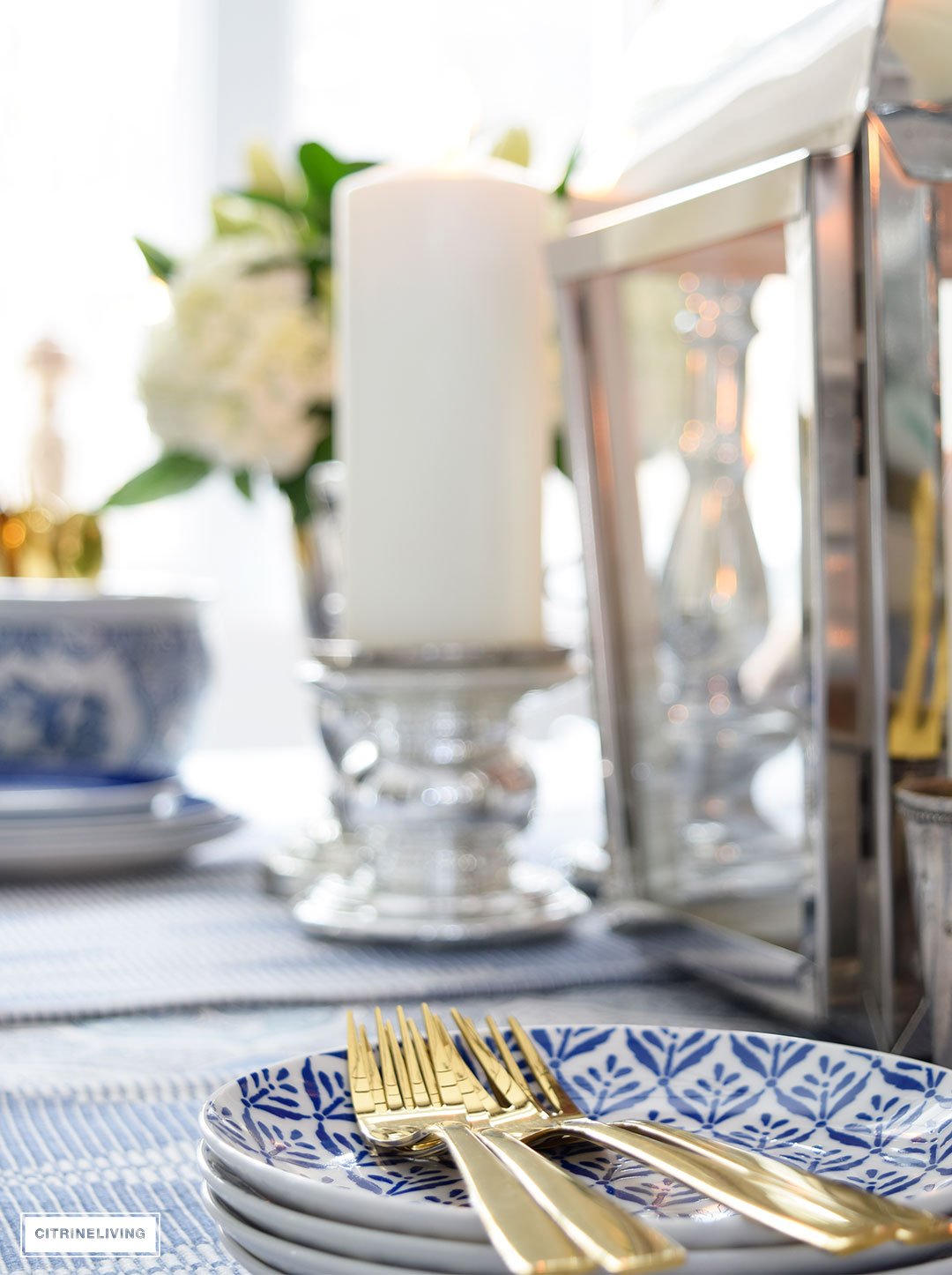 Gold flatware and blue dishes is always fresh for Spring.