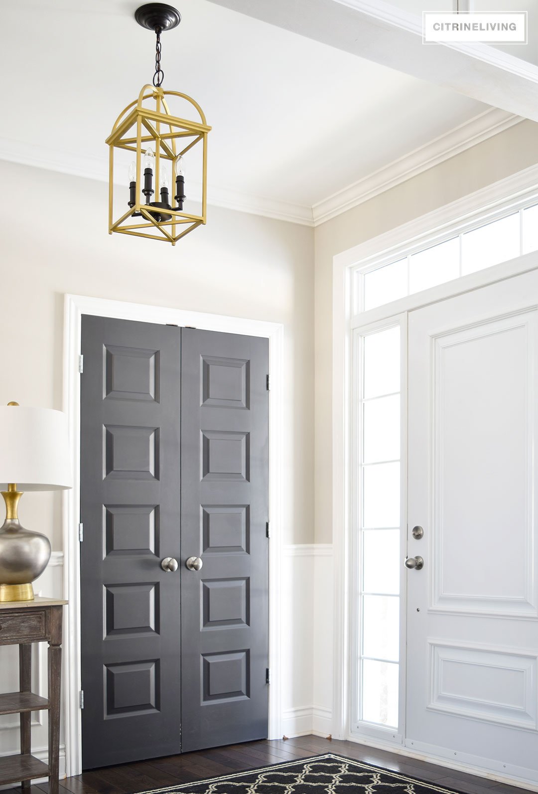 A two-toned brass and black lantern is the perfect addition to an entryway or hallway.