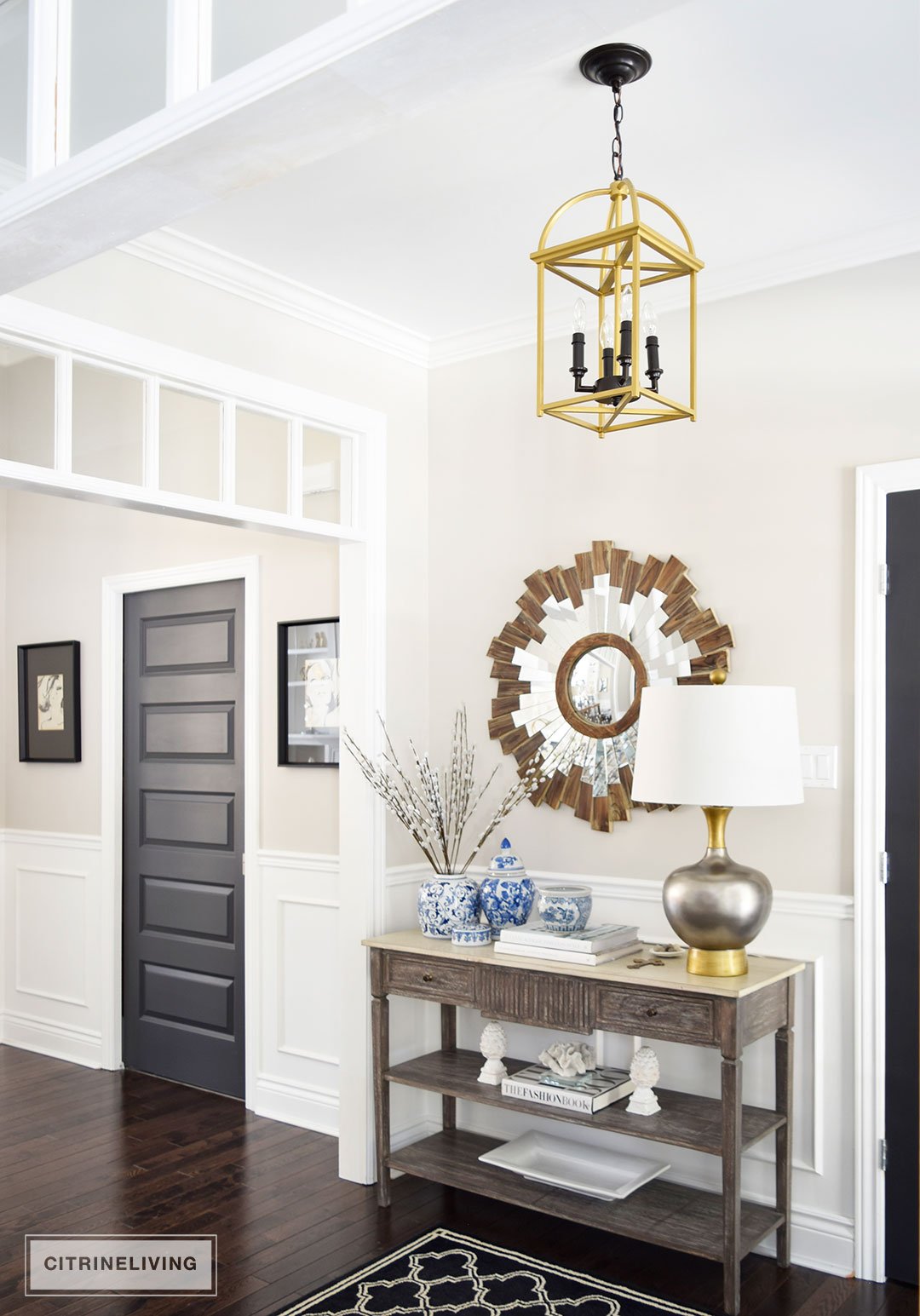 A two-toned brass and black lantern is the perfect addition to an entryway or hallway.