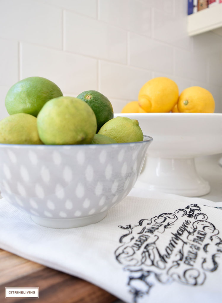 Add the perfect touch for the Spring and Summer seasons with vibrant lemons and limes in displayed in pretty bowls.