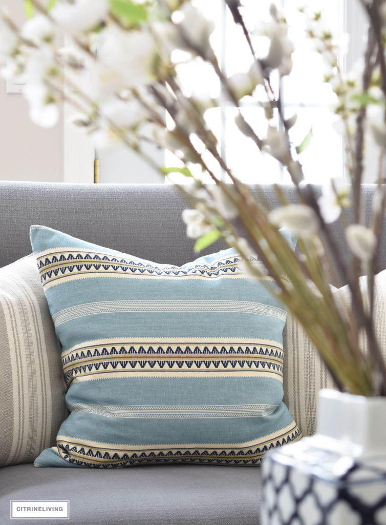 Beautiful Henderson Stripe pillow in sky from Tonic Living. Bring freshness to your home this Spring with layers of beautiful blues, fresh and faux florals, and new modern art and textiles. 