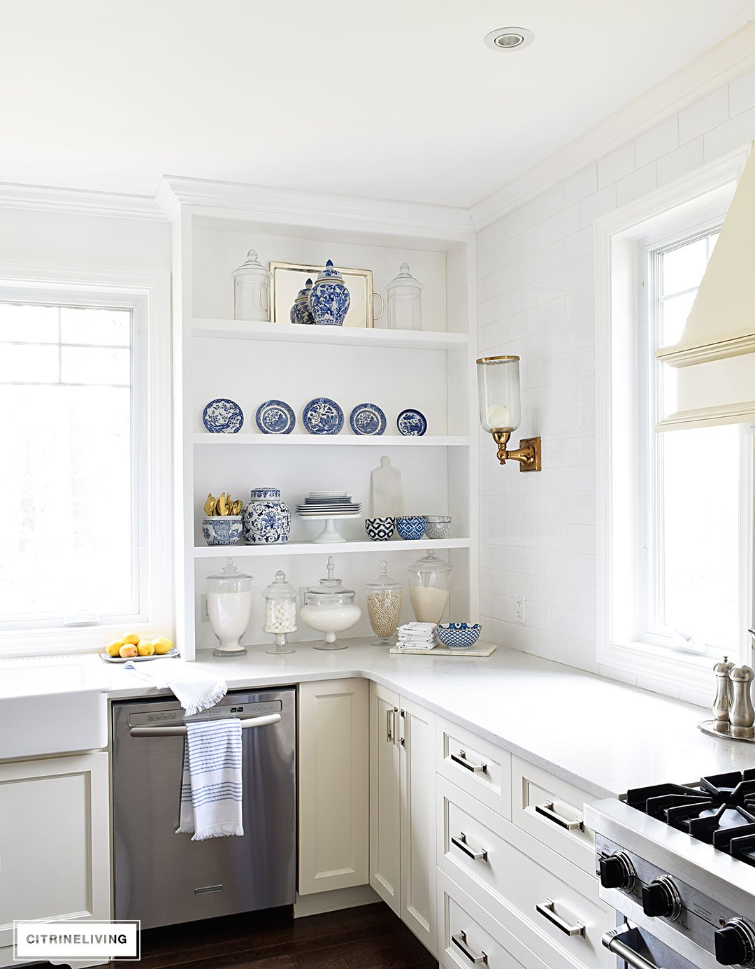 A white kitchen with open shelving is the perfect home for gorgeous blue and white accessories and dishes on display.