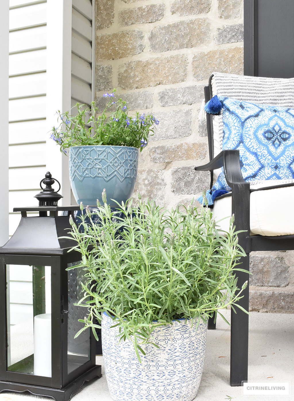 Create a chic Spring porch decorated with blue and white accents: garden stools, potted plants with some boho-chic and nautical pieces thrown into the mix!