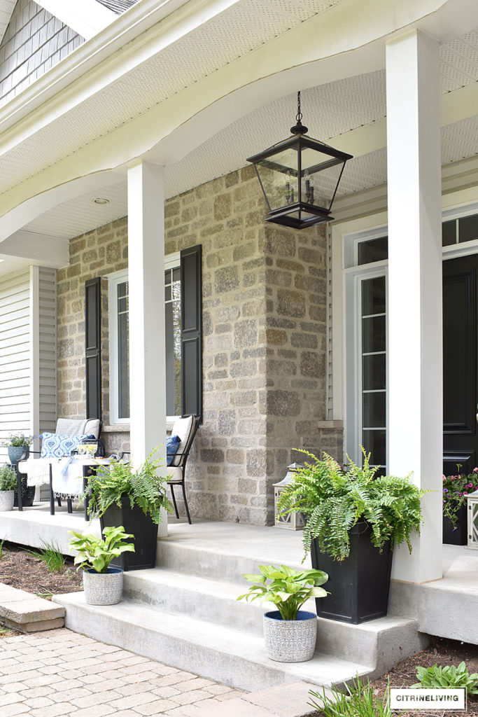 SPRING PORCH DECORATED WITH BLUE AND WHITE ACCENTS