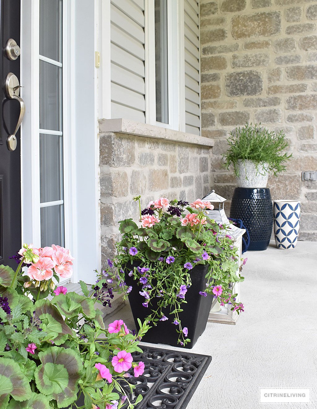 Create a chic Spring porch decorated with blue and white accents: garden stools, potted plants with some boho-chic and nautical pieces thrown into the mix!