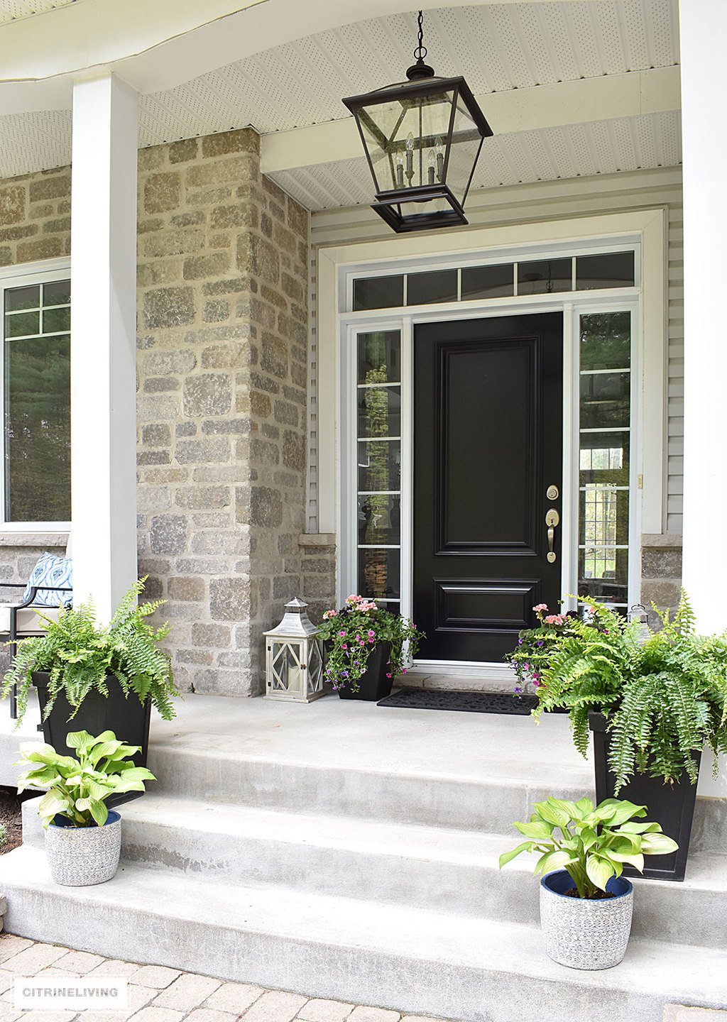 Create a chic Spring porch decorated with blue and white accents: garden stools, potted plants with some boho-chic and nautical pieces thrown into the mix!