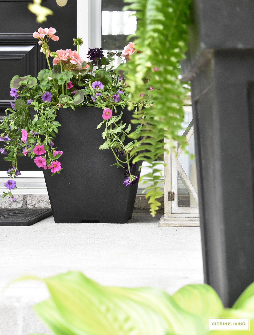 Create a chic Spring porch decorated with blue and white accents: garden stools, potted plants with some boho-chic and nautical pieces thrown into the mix!