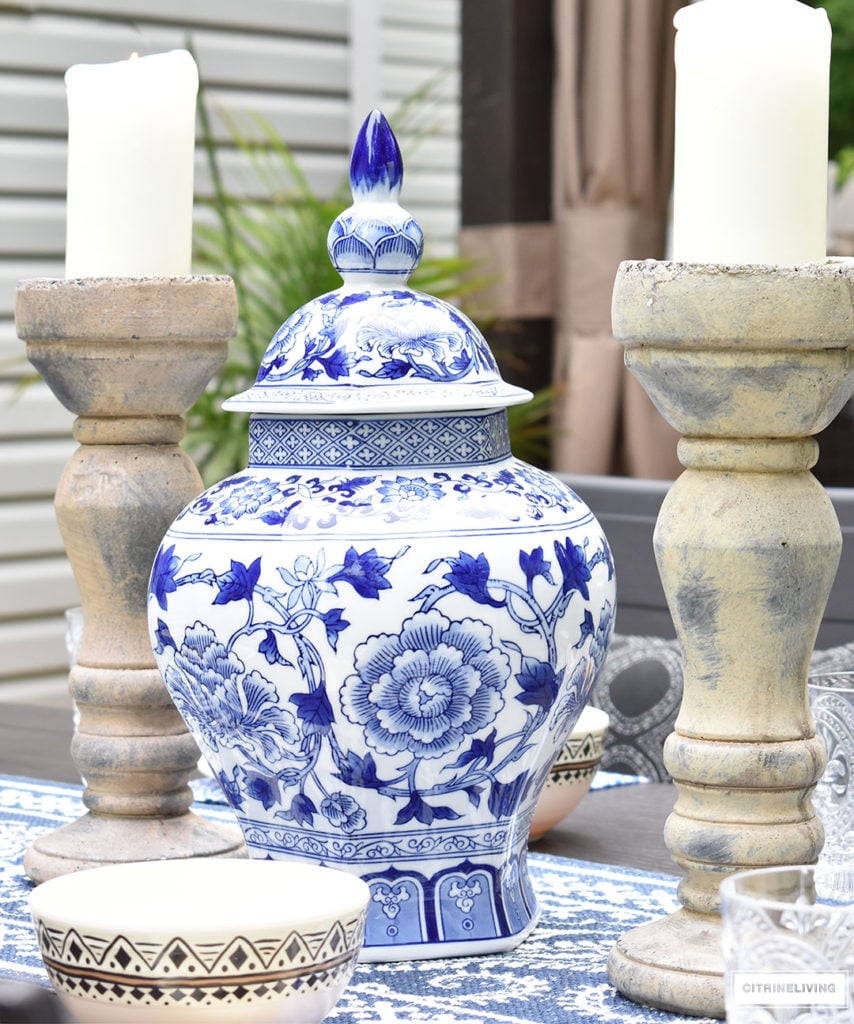 Blue and white accessories and linens paired with Moroccan inspired outdoor dishware are the ideal compliment for al fresco entertaining! Keep the look classic with ginger jars, lanterns and candles arranged symmetrically. 