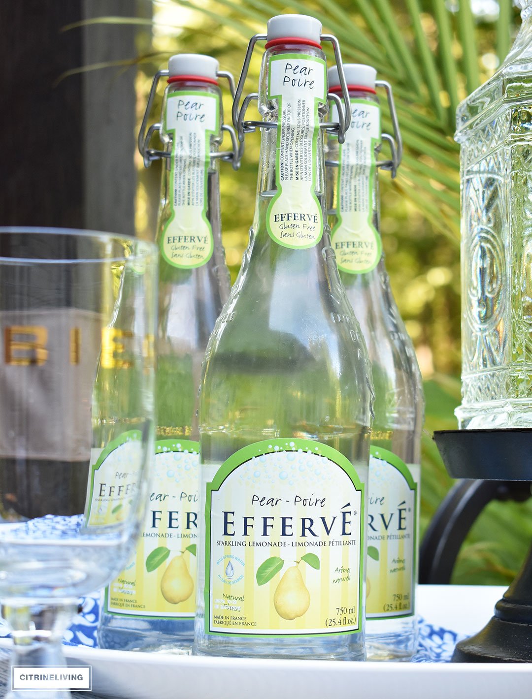 Use an outdoor bar cart layered with vintage inspired glassware and drink dispensers for your Summer entertaining.