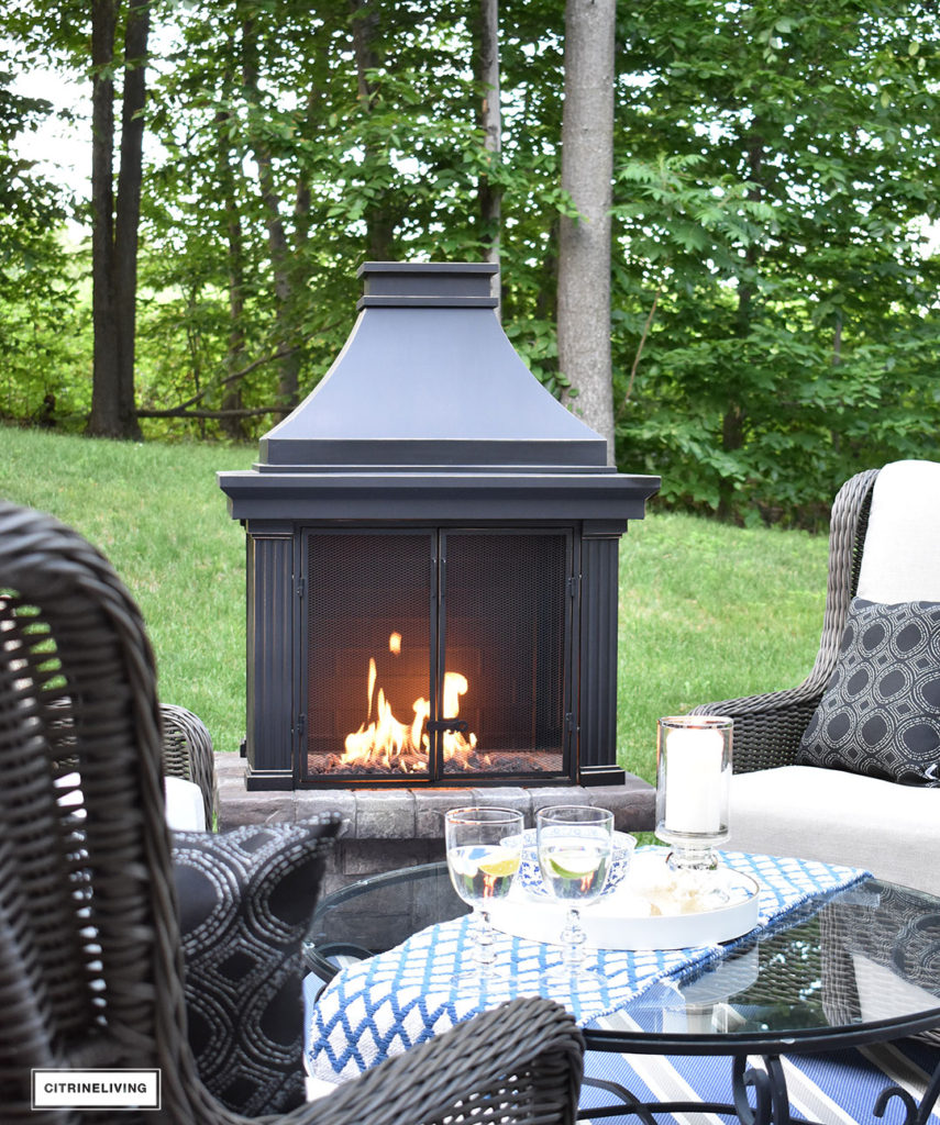 Create a warm and inviting conversation area on your patio this Summer with a gorgeous fireplace and resin wicker wingback chairs. Perfect for gathering with friends and family, to relaxing in the mornings with coffee!