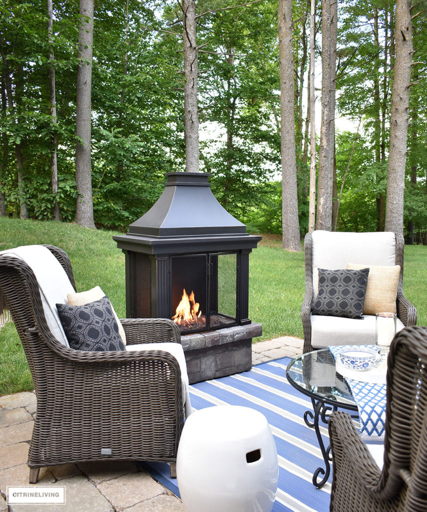 Create a warm and inviting conversation area on your patio this Summer with a gorgeous fireplace and resin wicker wingback chairs. Perfect for gathering with friends and family, to relaxing in the mornings with coffee!