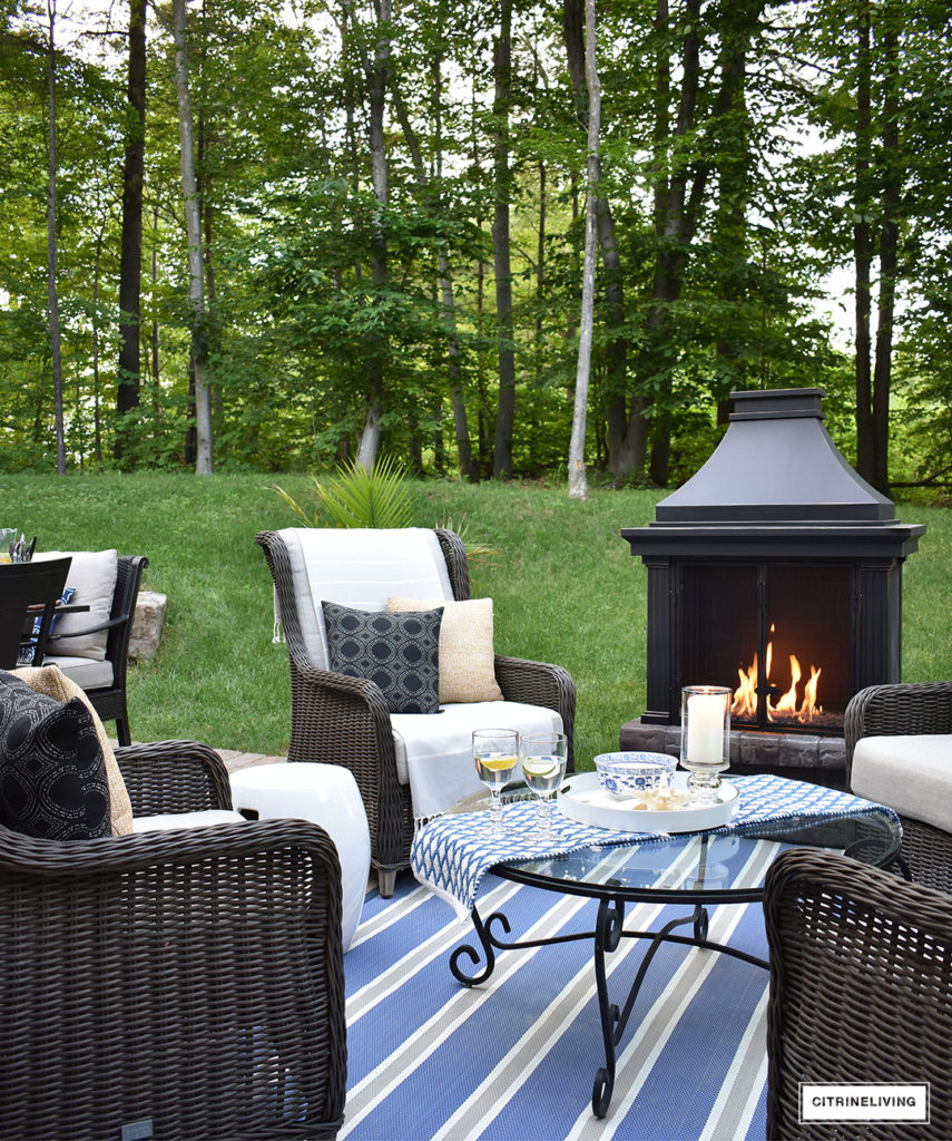 Create a warm and inviting conversation area on your patio this Summer with a gorgeous fireplace and resin wicker wingback chairs. Perfect for gathering with friends and family, to relaxing in the mornings with coffee!