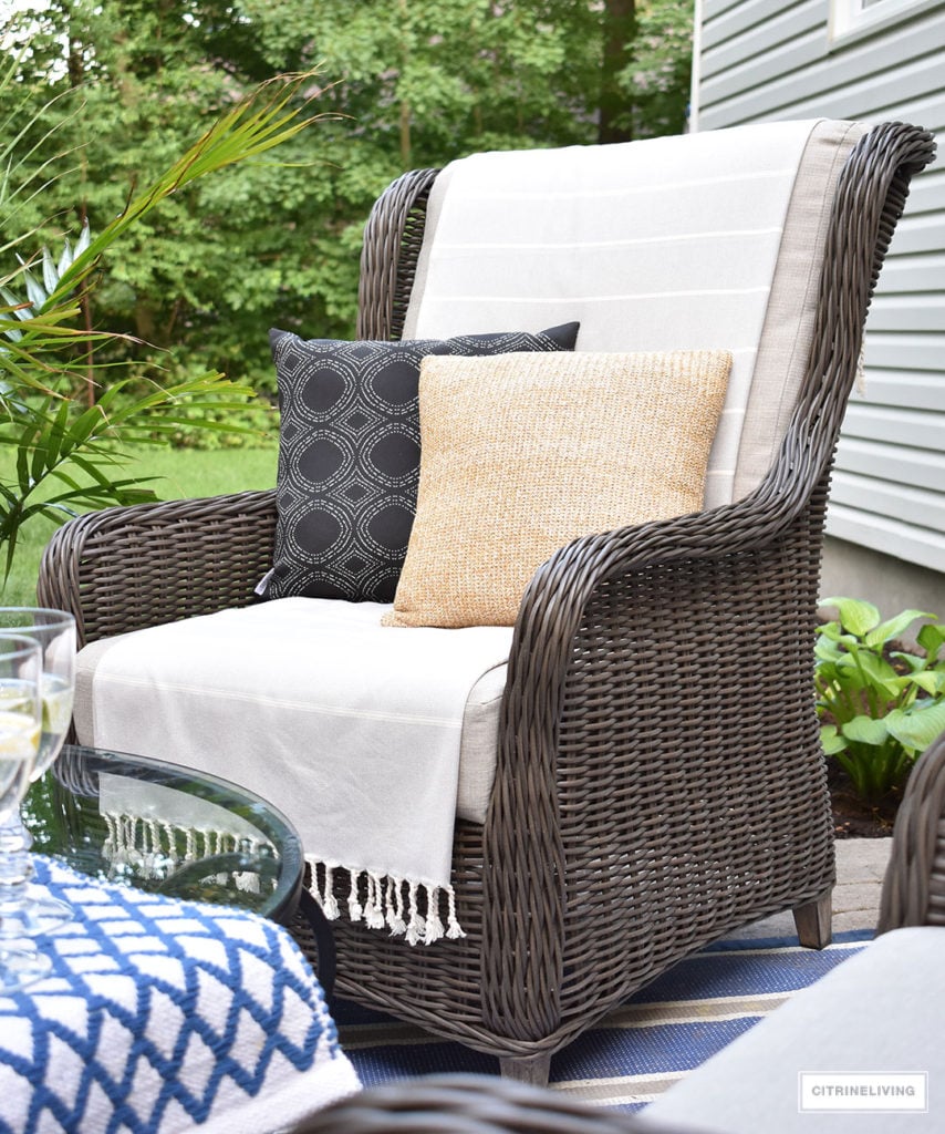 Beautiful, resin wicker wingback chairs are the perfect spot to relax and enjoy coffee or a beverage in your backyard this Summer!