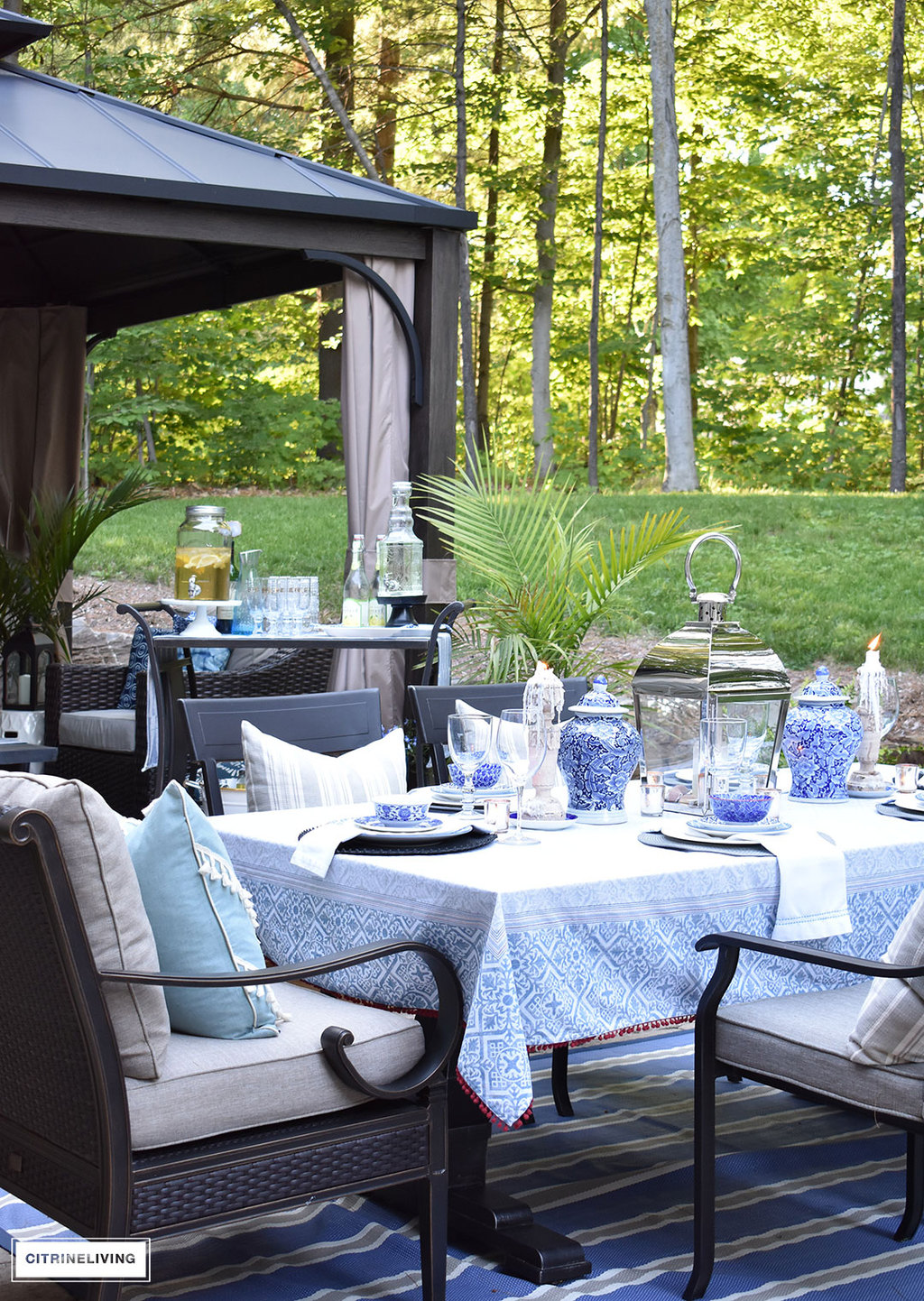 Layers of blue and white mixed with pattern and texture is a key element in this outdoor setting.