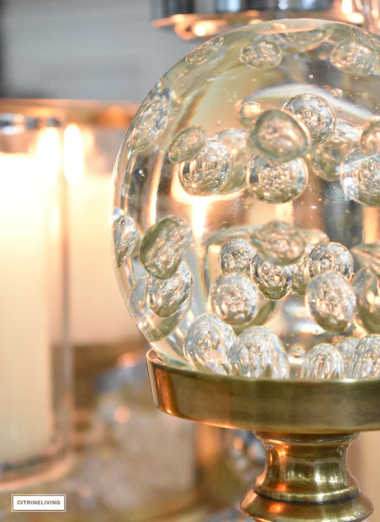 Make a visual statement with a clustered grouping of metal and glass candleholders in varying heights on your coffee table.