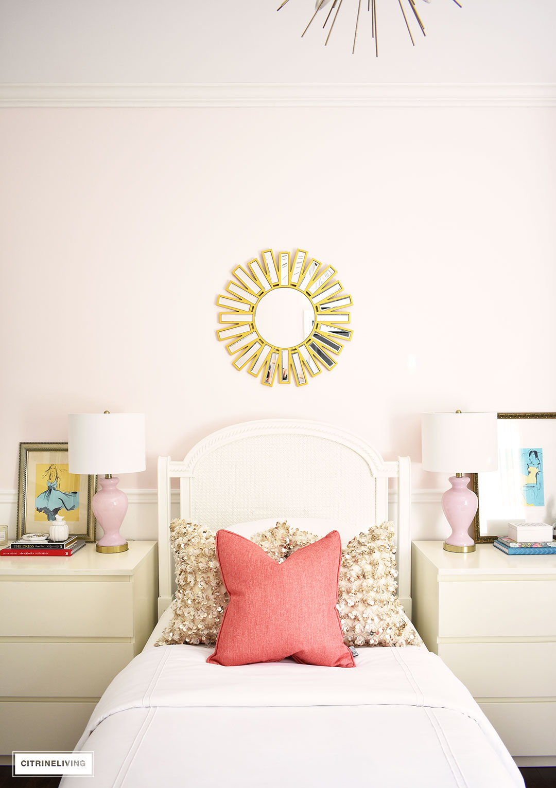 A chic, modern girl's bedroom featuring blush pink walls, coral and brass accessories and brass lighting, is a fun and sophisticated look!