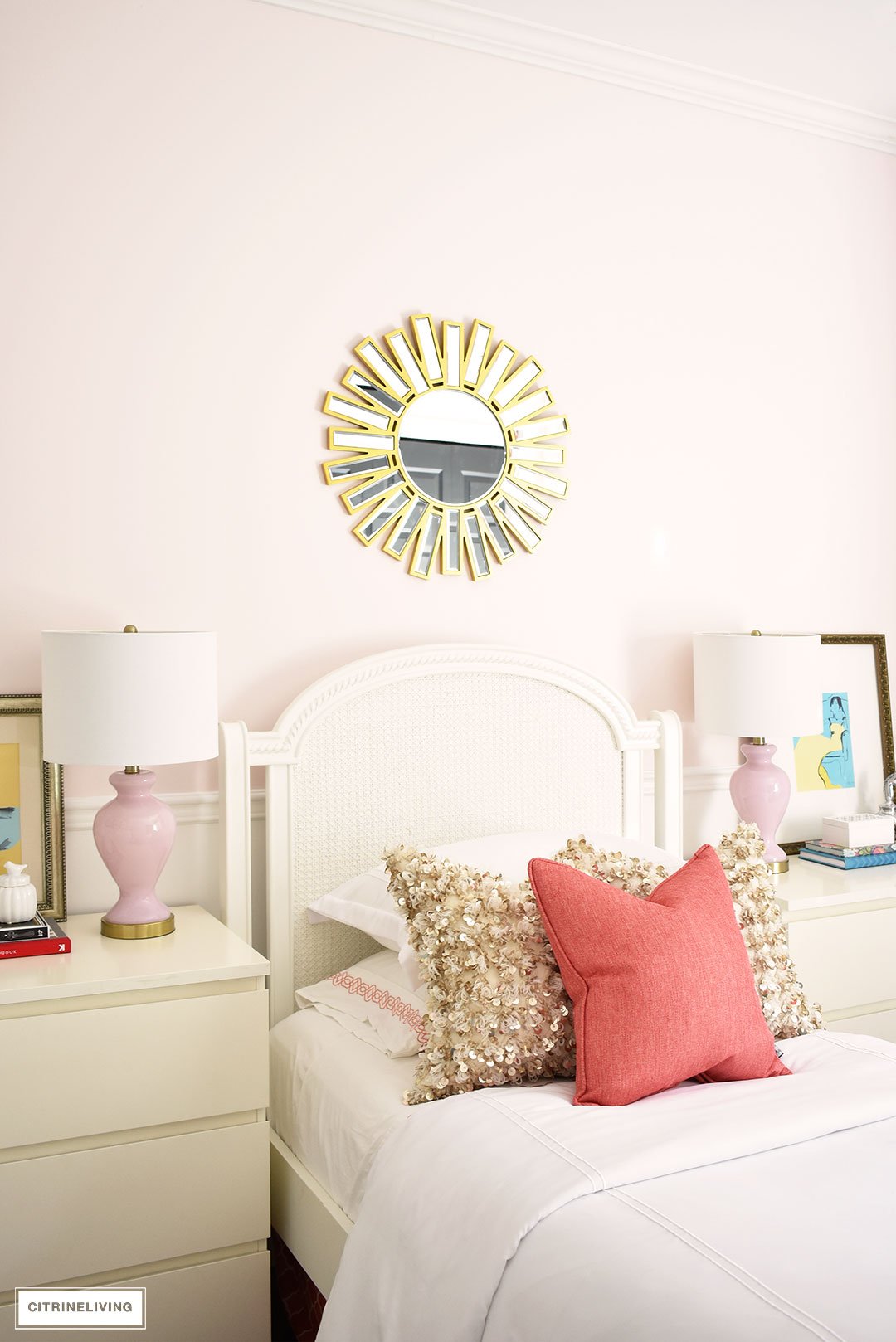 A chic, modern girl's bedroom featuring blush pink walls, coral and brass accessories and brass lighting, is a fun and sophisticated look!