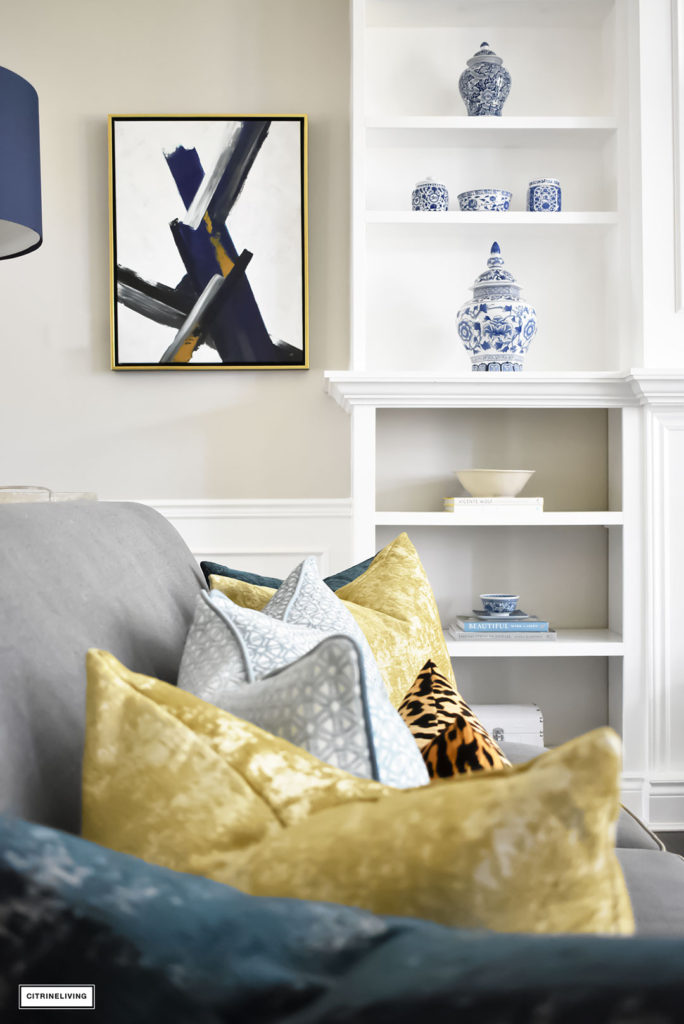 Fall Home Tour with navy and gold velvet pillows and accents. Brass lighting and leopard pillow. Blue and white ginger jars. Modern art.