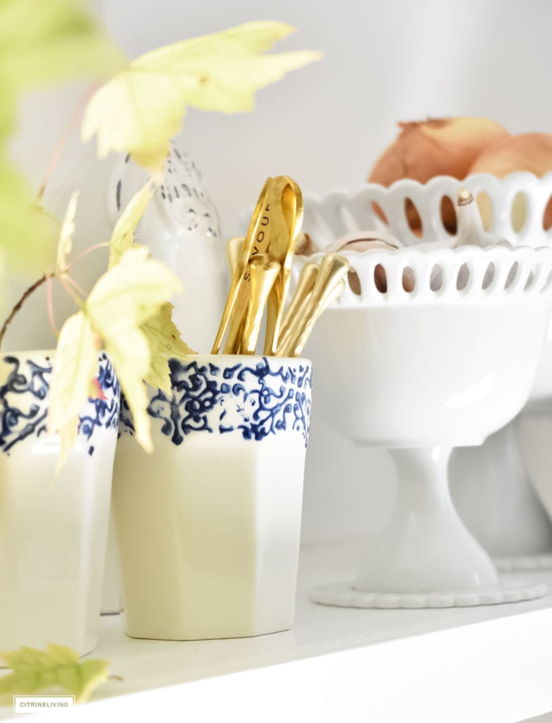 Fall Home Tour - casual elegant black and white kitchen with built-in shelving. Blue and white dishes and fall foliage.