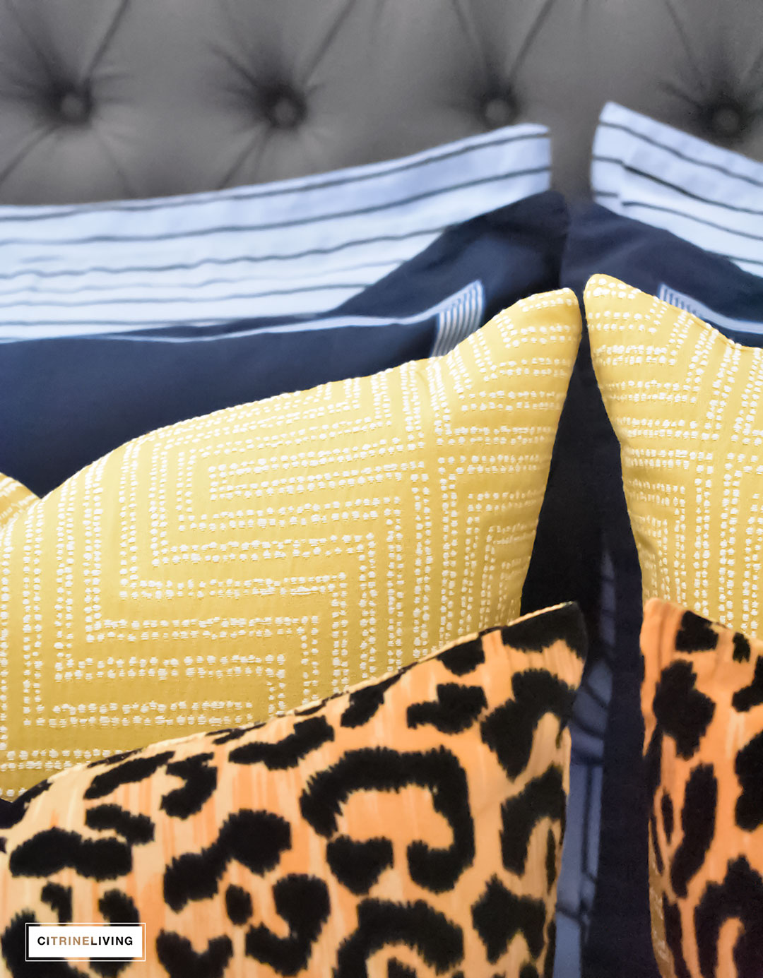 Gorgeous Blue Fall master bedroom - A masculine meets glam look with navy blue, stripes, paisley ikat, greek key, leopard and gold - perfectly tailored and chic!