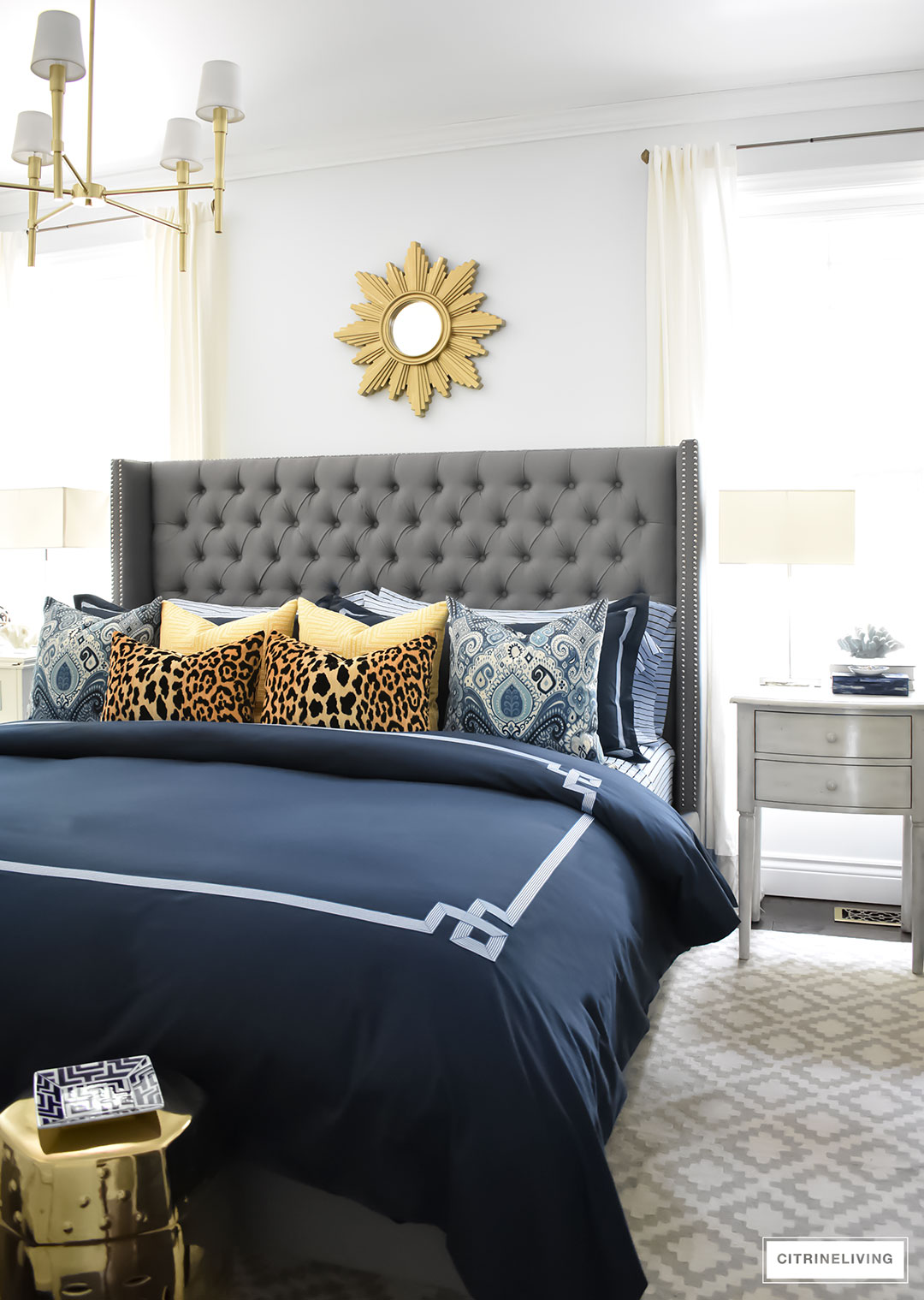 Gorgeous Blue Fall master bedroom - A masculine meets glam look with navy blue, stripes, paisley ikat, greek key, leopard and gold - perfectly tailored and chic!