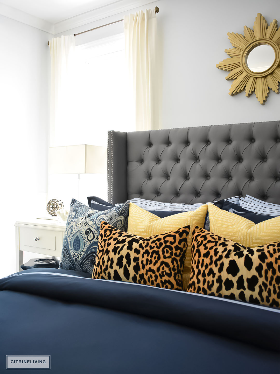 Gorgeous Blue Fall master bedroom - A masculine meets glam look with navy blue, stripes, paisley ikat, greek key, leopard and gold - perfectly tailored and chic!
