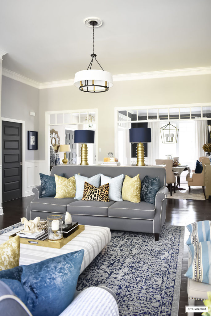 Fall Home Tour with navy and gold velvet pillows and accents. Brass lighting, leopard pillow, drum shade chandelier.
