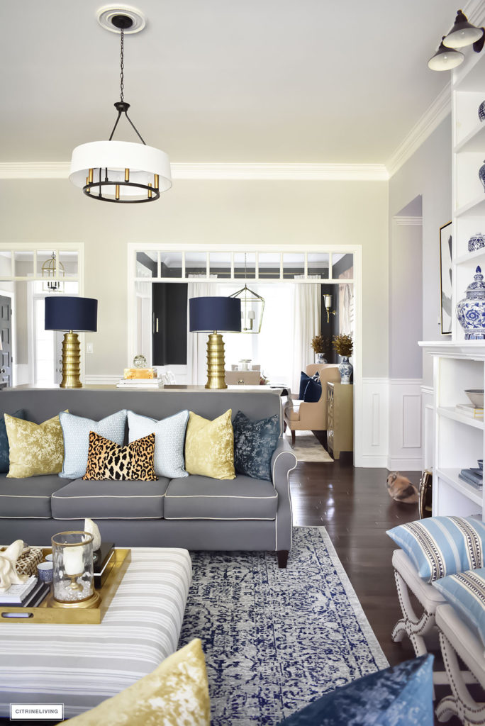 Fall Home Tour with navy and gold velvet pillows and accents. Brass lighting, leopard pillow, drum shade chandelier.