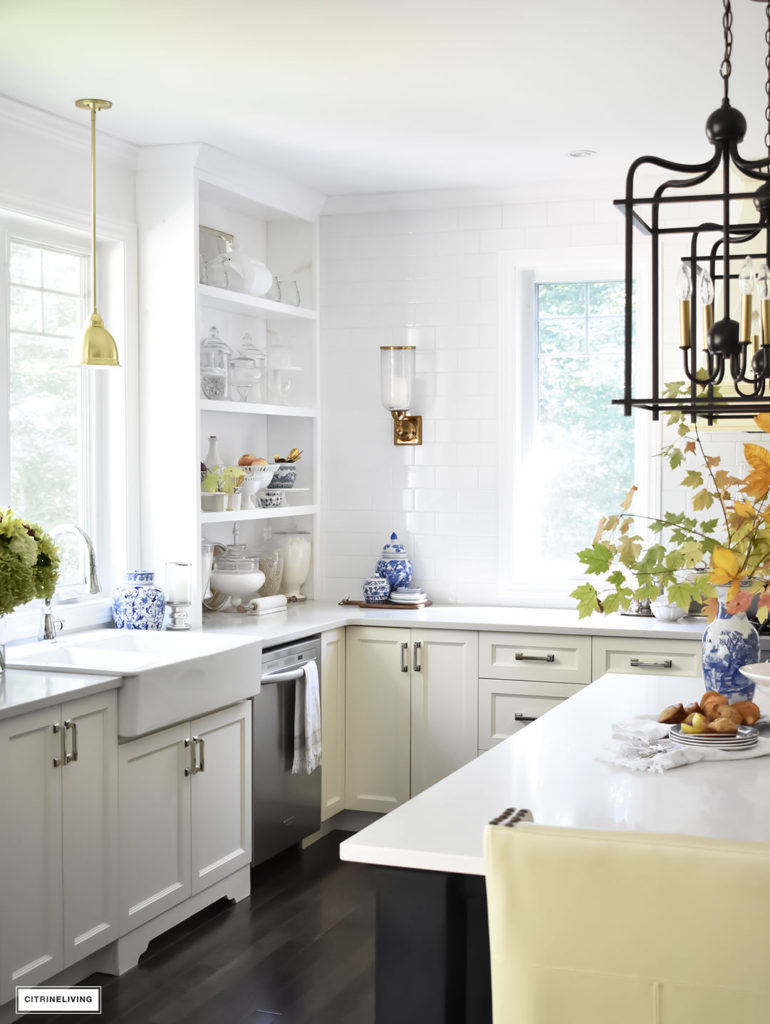 Fall Home Tour - casual elegant black and white kitchen with built-in shelving. Blue and white dishes and fall foliage.