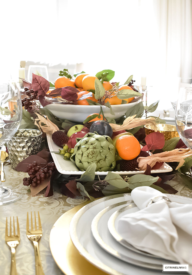 Gorgeous, elegant and bountiful thanksgiving tablescape layered with rich colors and textures from Autumn's beautiful bounty.