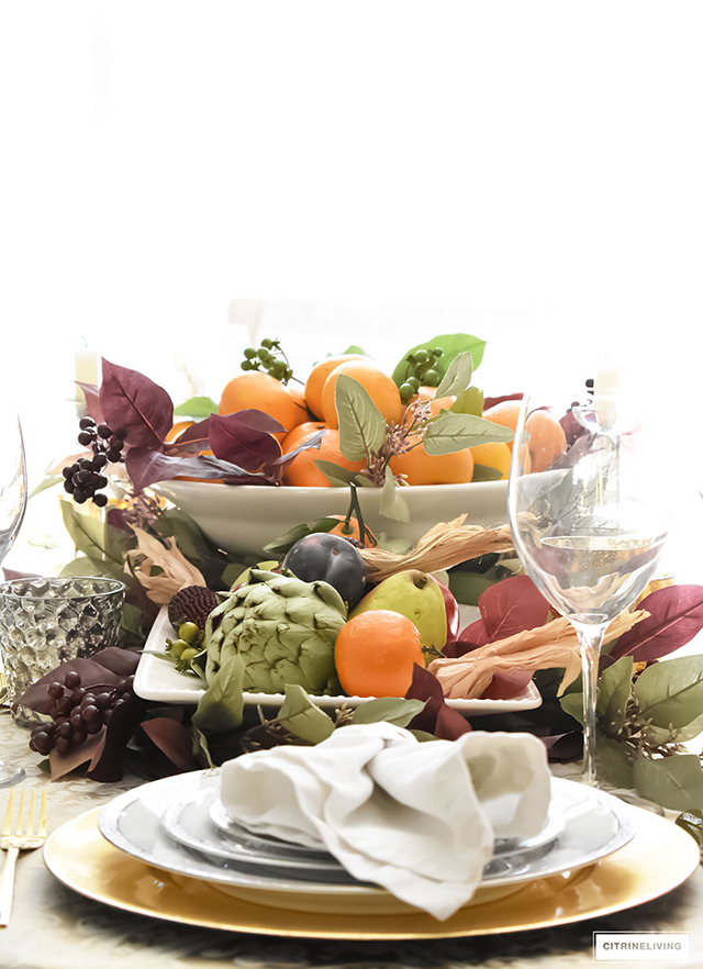 Gorgeous, elegant and bountiful thanksgiving tablescape layered with rich colors and textures from Autumn's beautiful bounty.