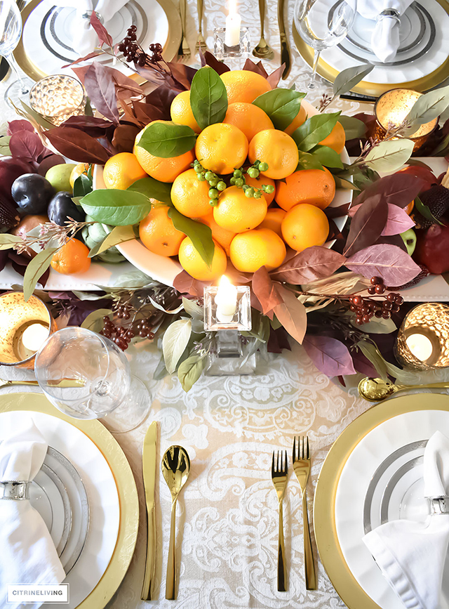 Gorgeous, elegant and bountiful thanksgiving tablescape layered with rich colors and textures from Autumn's beautiful bounty.