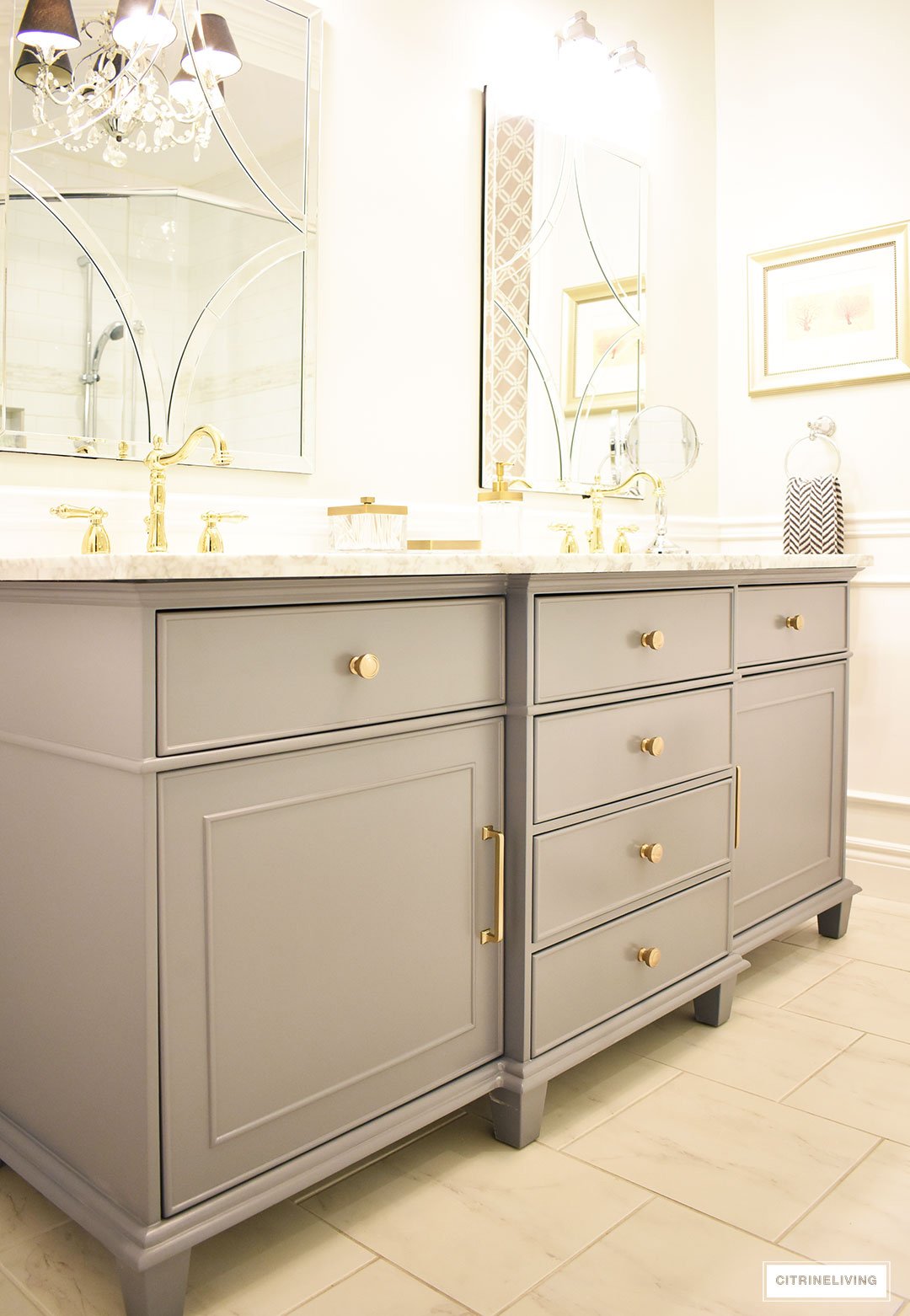 Gorgeous gray vanity with beautiful brass hardware and faucets - our master bathroom makeover is underway! 